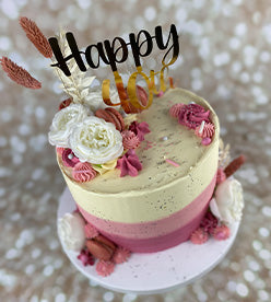 40th birthday cake with 2 toned pink buttercream and dried flowers