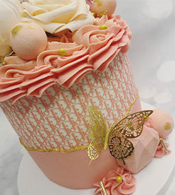 pink girly birthday cake with Christian Dior print