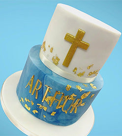 2 tier christening cake with blue marble effect, gold leaf and gold cross