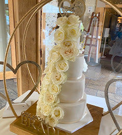 4 tier wedding cake with flowers