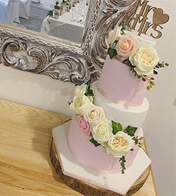 4 tier wedding cake with flowers
