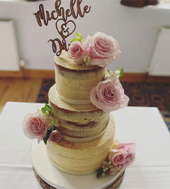 3 tier naked wedding cake with flowers