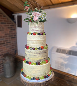 4 tier naked wedding cake with fruit